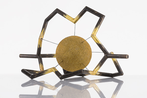 Anne Fischer, a silversmith from Nuremberg, created a model of one of the new molecular cages, including the spherical metal ion. (Copyright: Dr. Max von Delius. Image: Birgit Sauer)