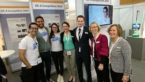 The FAU Team, consisting of Amir Y. Amin, Niall Kilillea and Dimitra Papadopoulo (from left to right) at the LOPEC fair in Munich. (Image: Mrs. Daria Firlus)