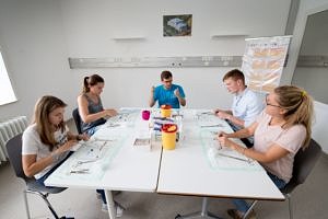 Five people around a table