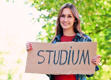 A female student holding a sign