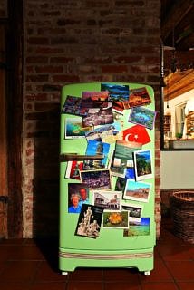 A fridge with postcards