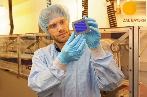 Dr. Andreas Distler with the organic record solar module.