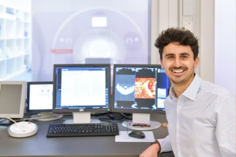 Dr. Simon Lévy in front of monitors