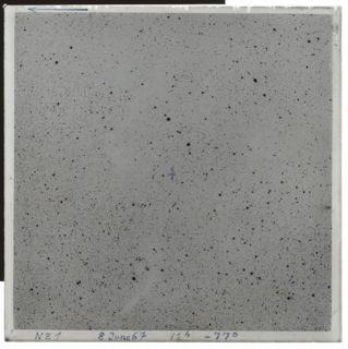 The photographic plate shows a negative of a section of sky in the Chamaeleon constellation in the southern sky. The stars are indicated as black points. High-resolution scans of such photographic plates are several hundred megapixels in size.