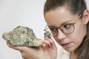 Irina Kirchberger, Doctoral candidate mineralogy studying a rock