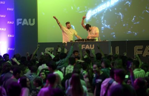 Photo of two DJs hosting a party at the FAU