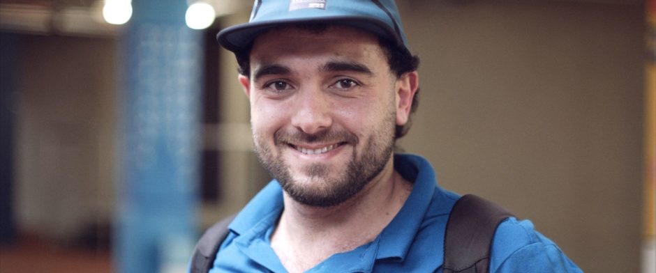 A man with beard and blue hat.