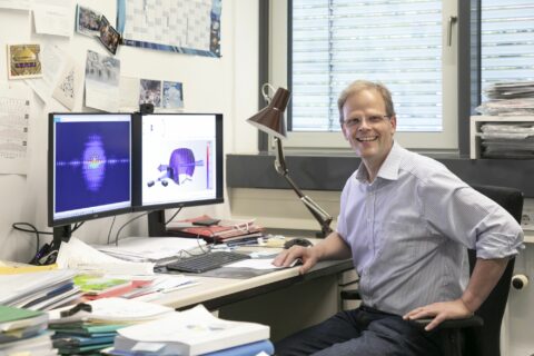 Prof. Dr. Joachim von Zanthier at his desk.