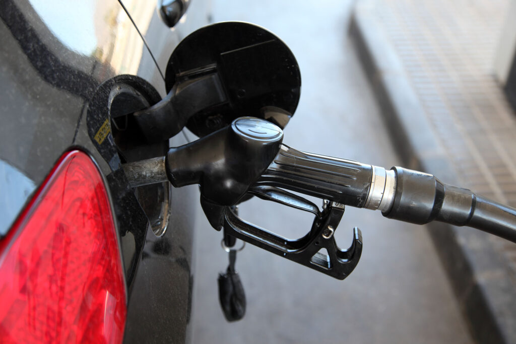 A car is being refueled.