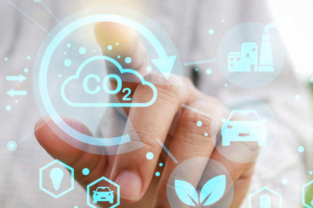 Man on meadow presses virtual energy and nature symbols in air with finger