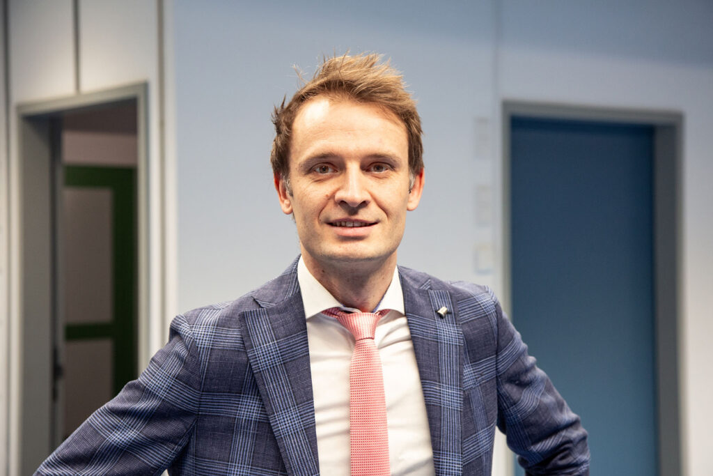 A man in a blue suit.