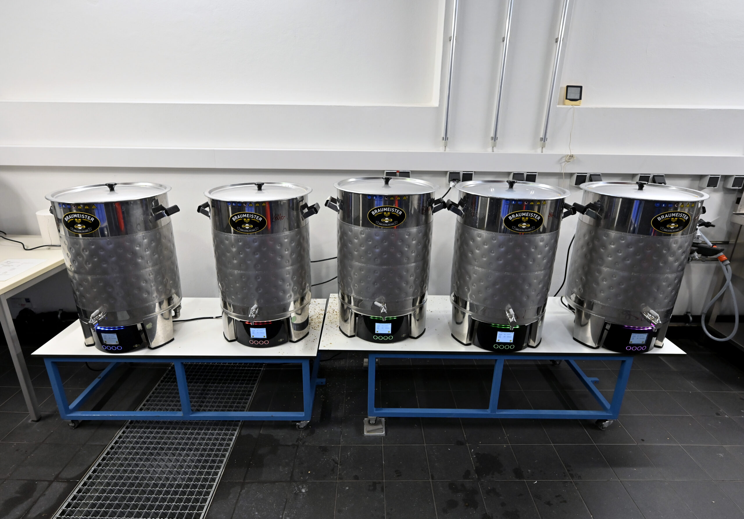 Five brewing kettles in a row.