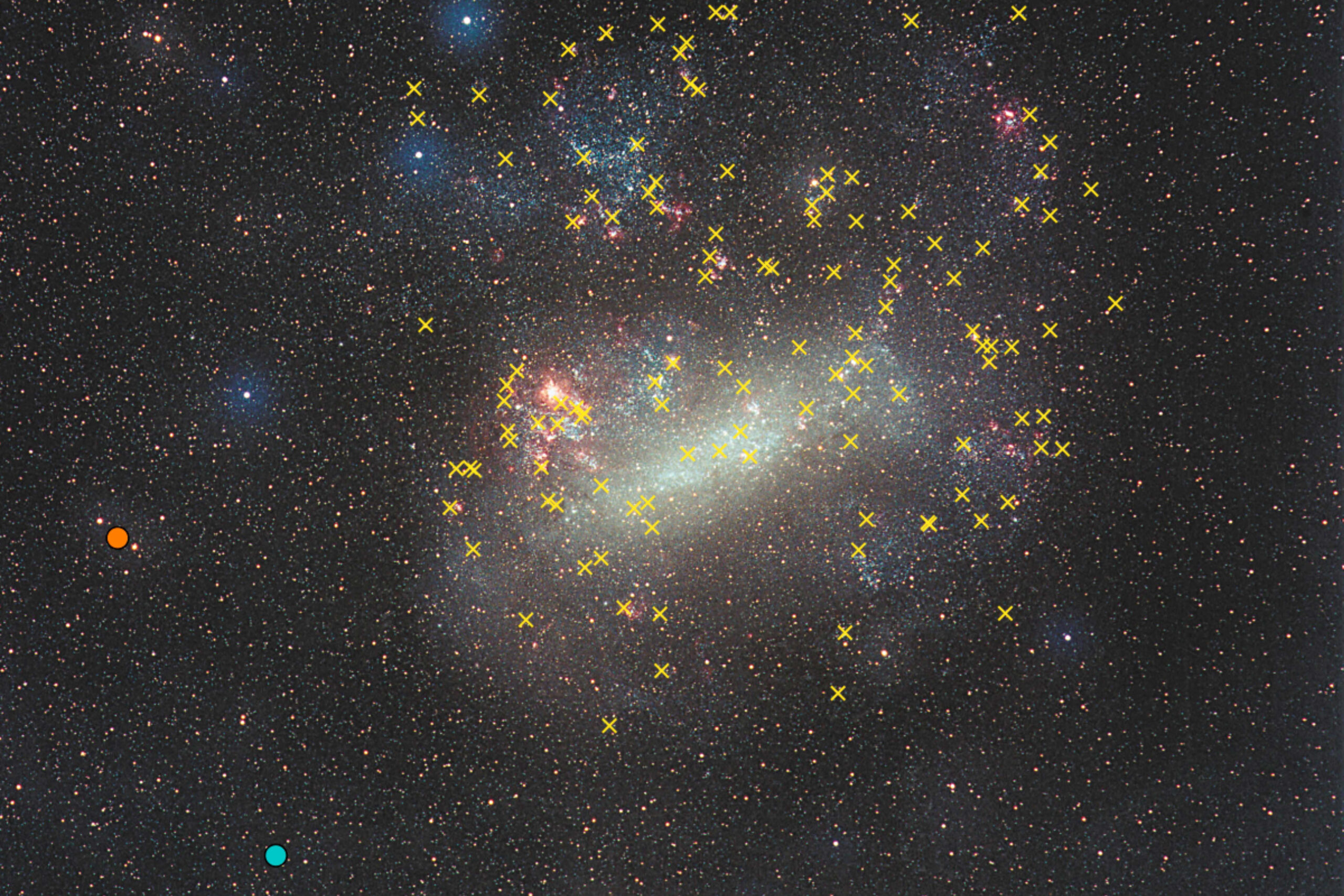 The Large Magellanic Cloud. The new supernova remnants are marked as orange and blue dots, the yellow crosses indicate the positions of other known supernova remnants. (Image: Eckhard Slawik, ESA/XMM-Newton)