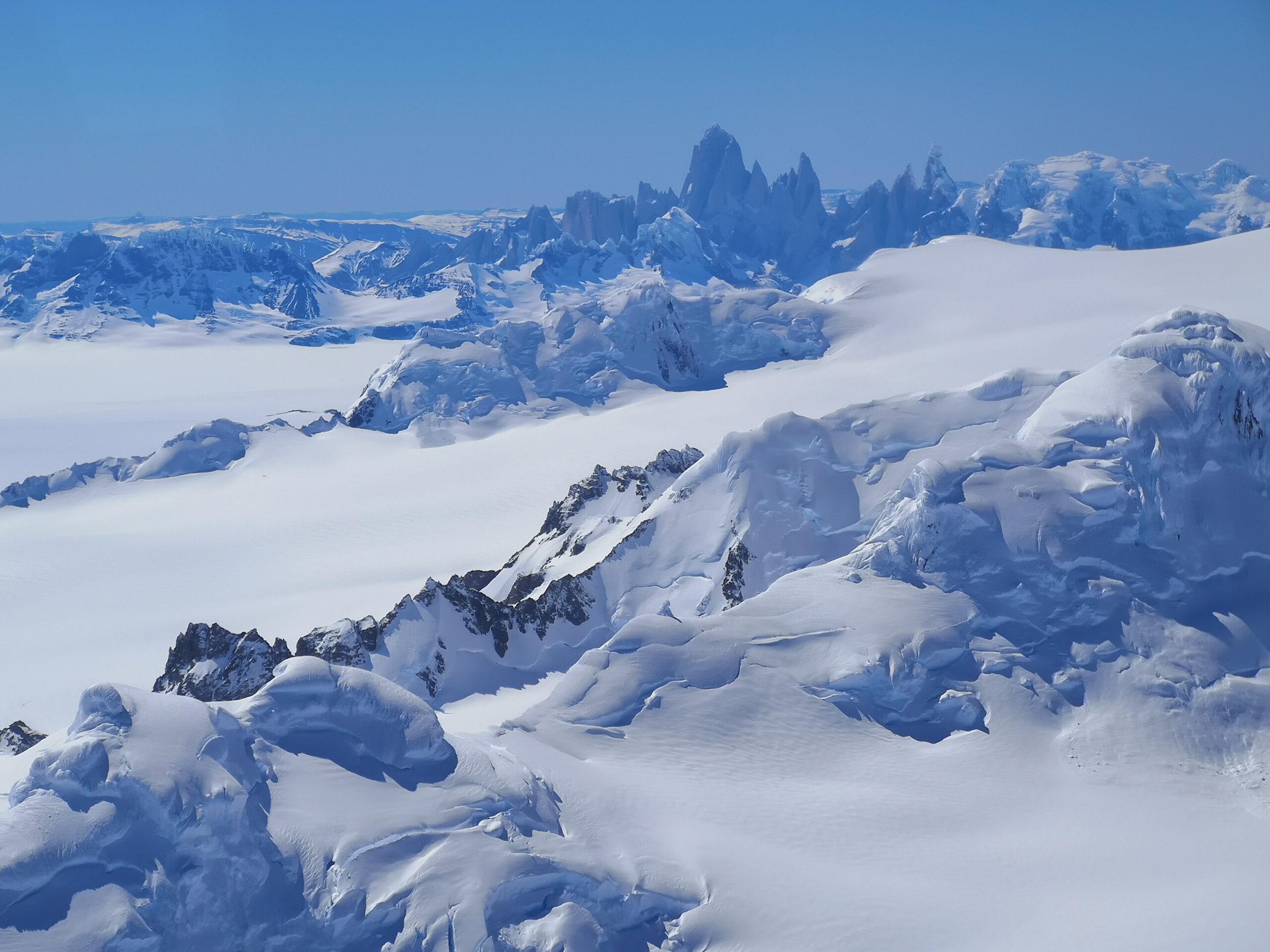View over the southern Patagonian ice sheet from Volcan Lautaro to Fitz Roy and Cerro Torre, Patagonia.