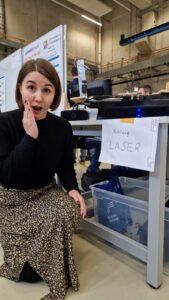 Young women with short hair makes a gesture of amazment. 