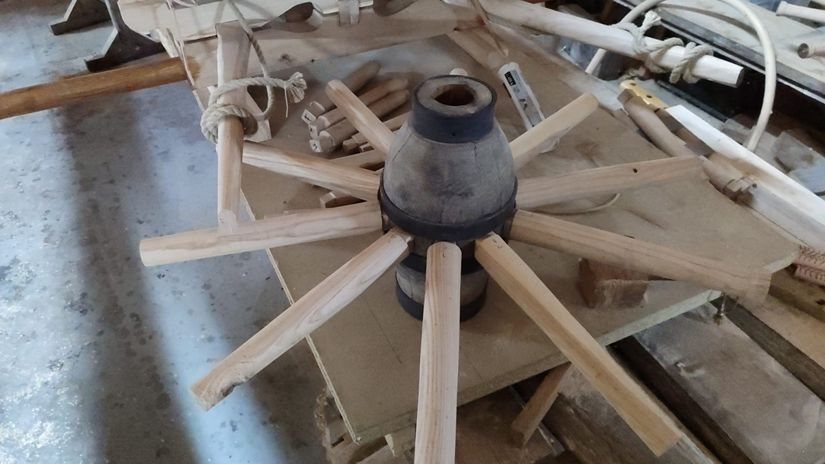 Ash spokes and iron wheel hub.