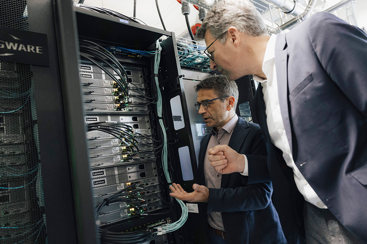 Secretary Blume and Prof. WEllein in front of a server.