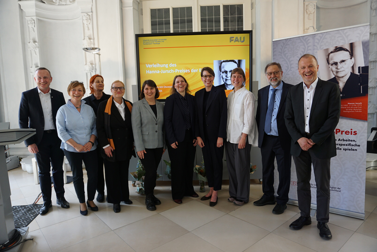 The award winners and the important officials at a group photo.