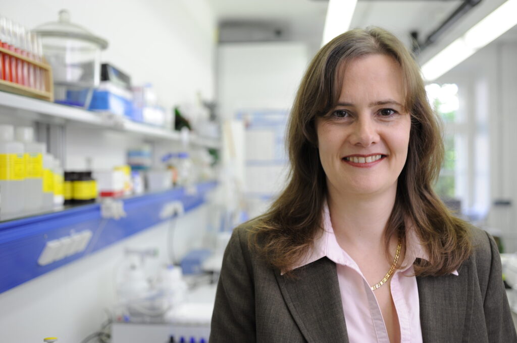 Woman in a lab smiles