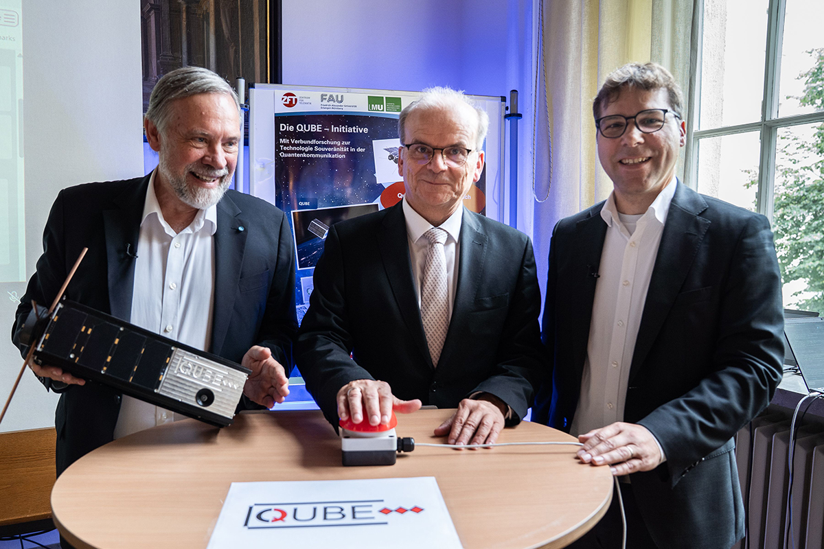 3 gentlemen with a satellite.