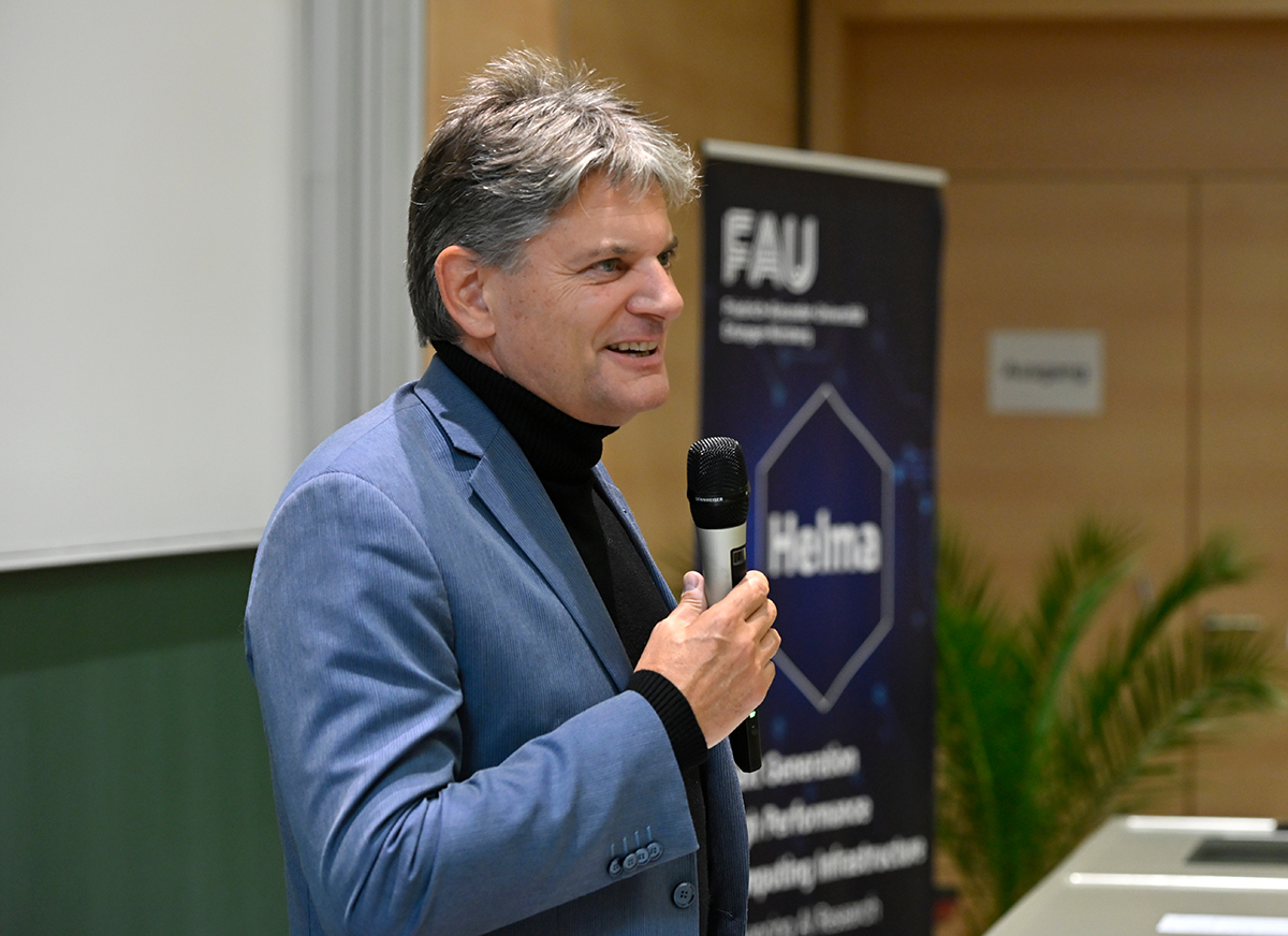 Prof. Hornegger in the blue sacko gives a speech