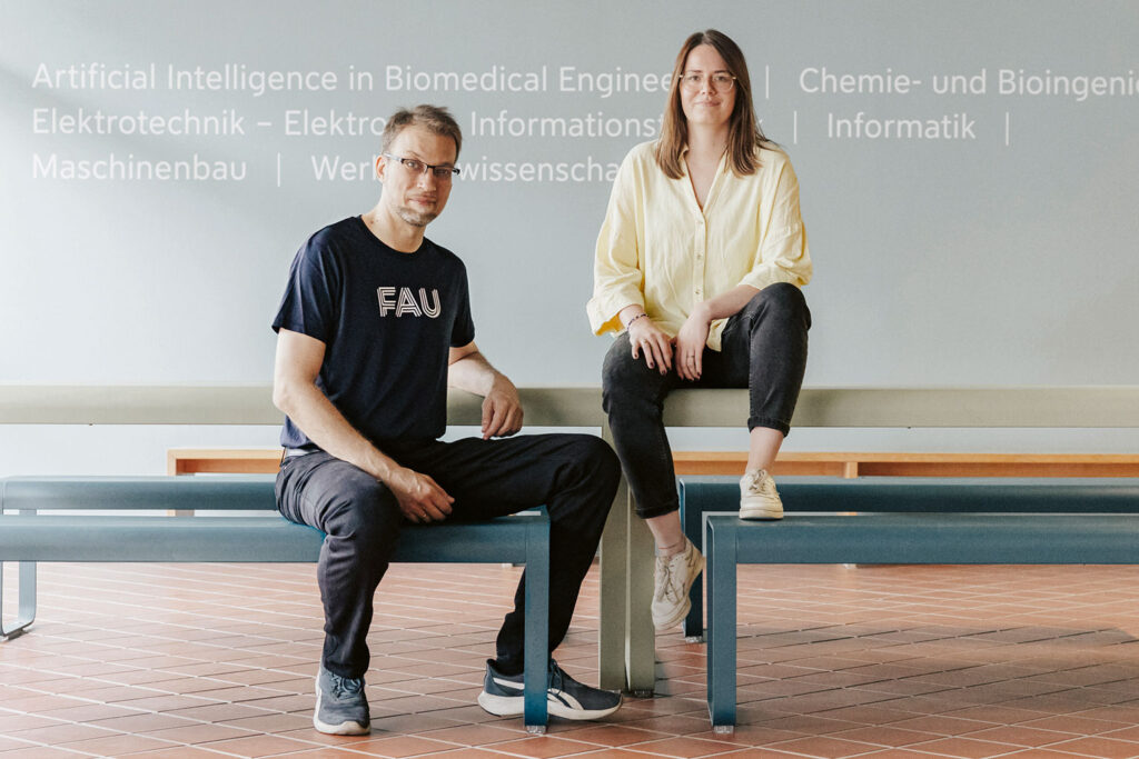 Two researchers sitting on benches.