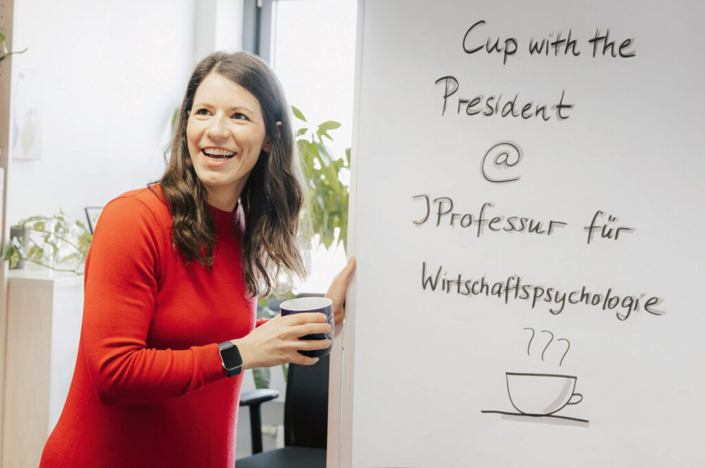 Lisa Handke in front of a whiteboard.