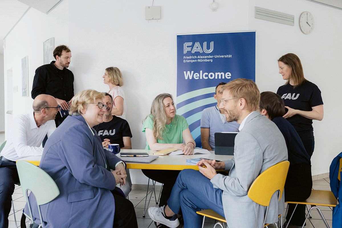 A group of people, talking to each other.