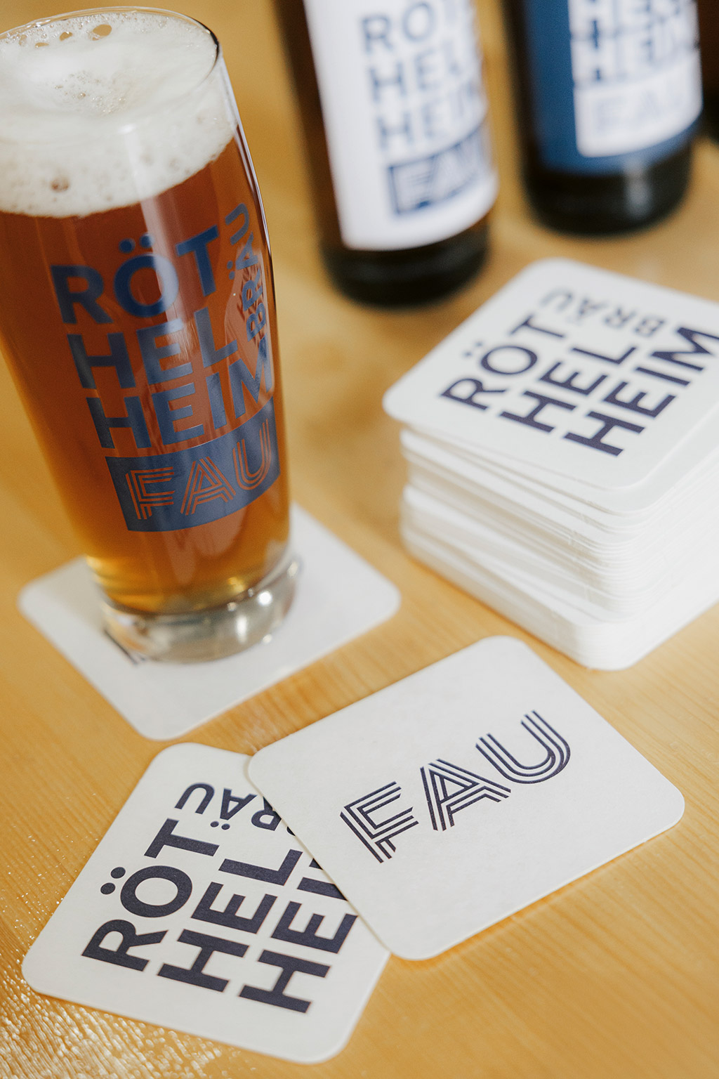 A glass of beer and bottles.