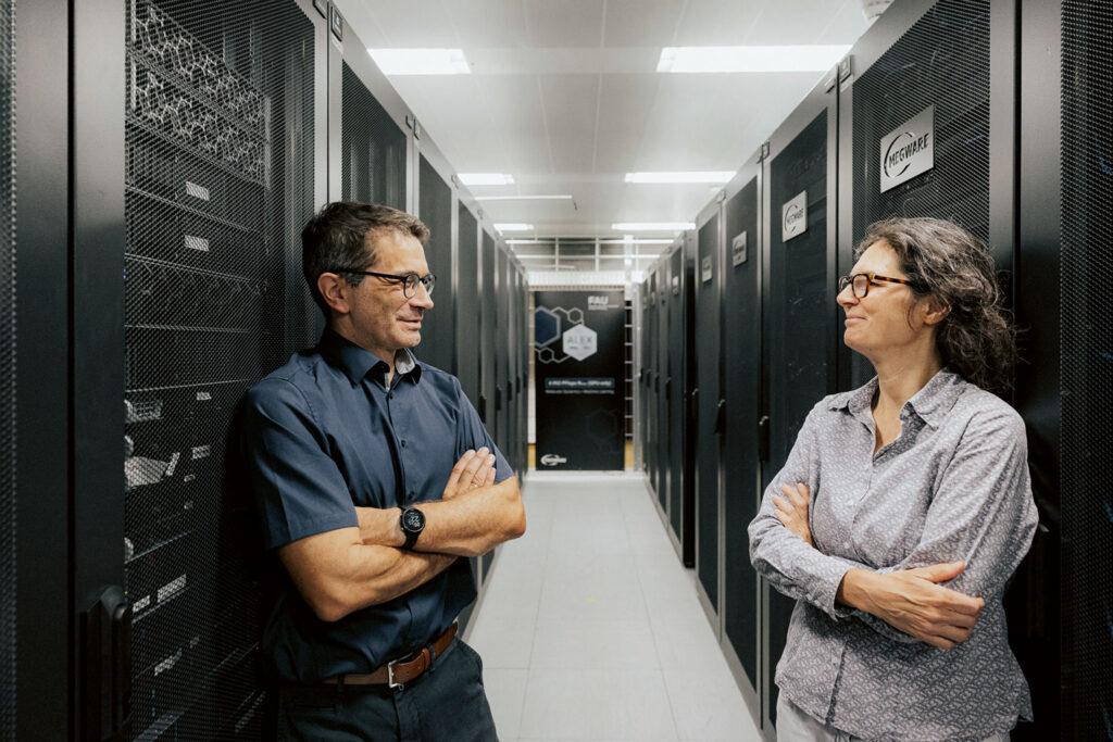 Gerhard Wellein and Petra Imhof in a server room.