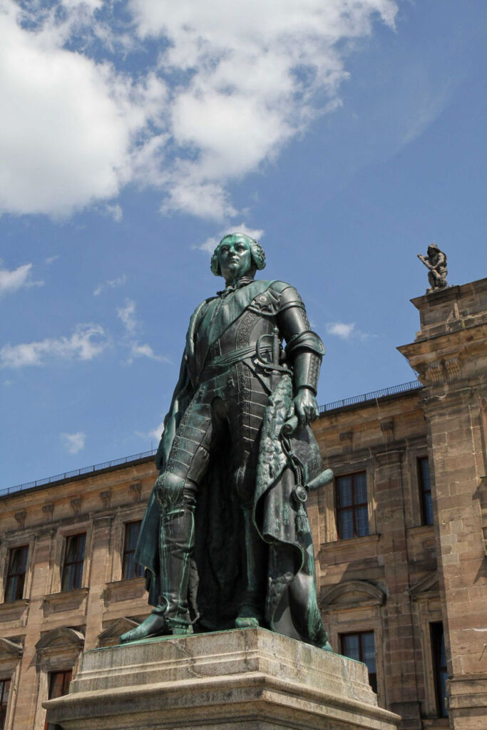 Statue of the Margrave at the Erlangen Schloss. The Schloss is visible in the background.