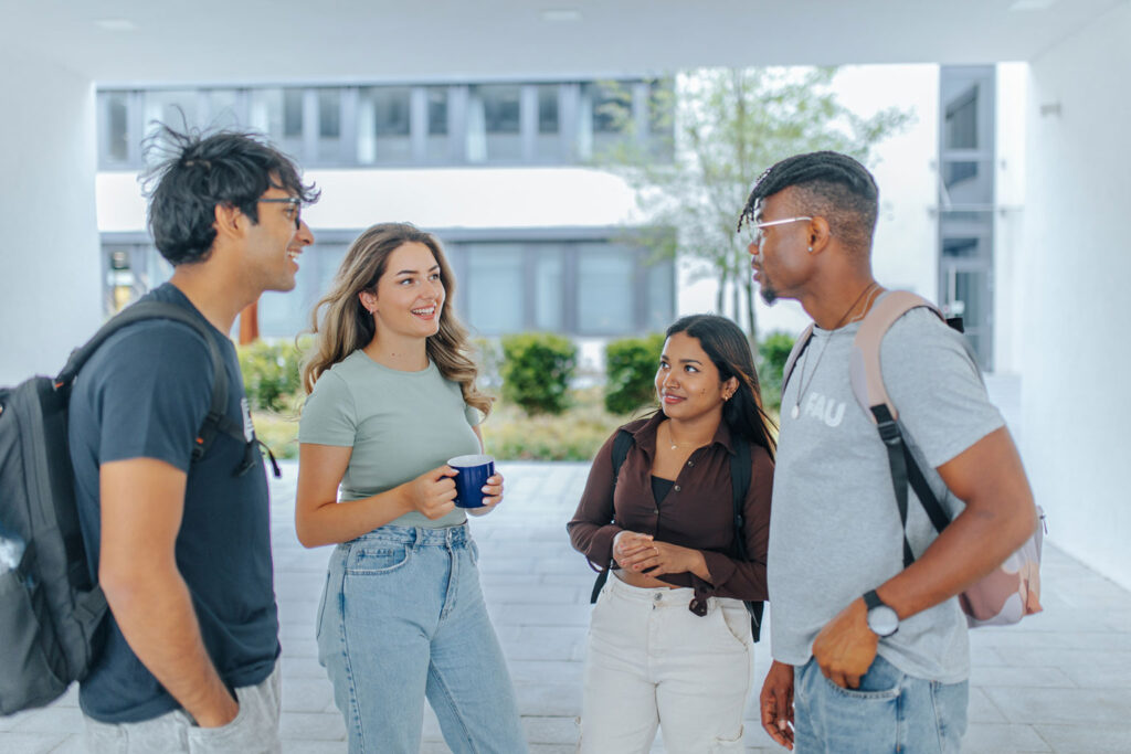 People standing together, chatting.
