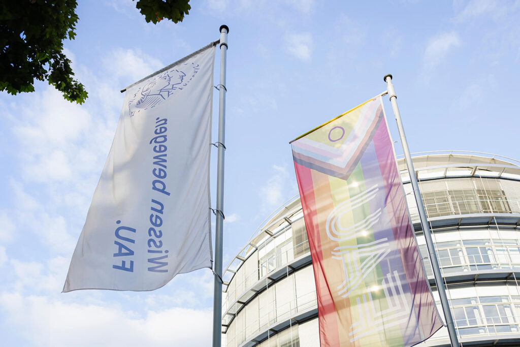 An FAU building with flags.