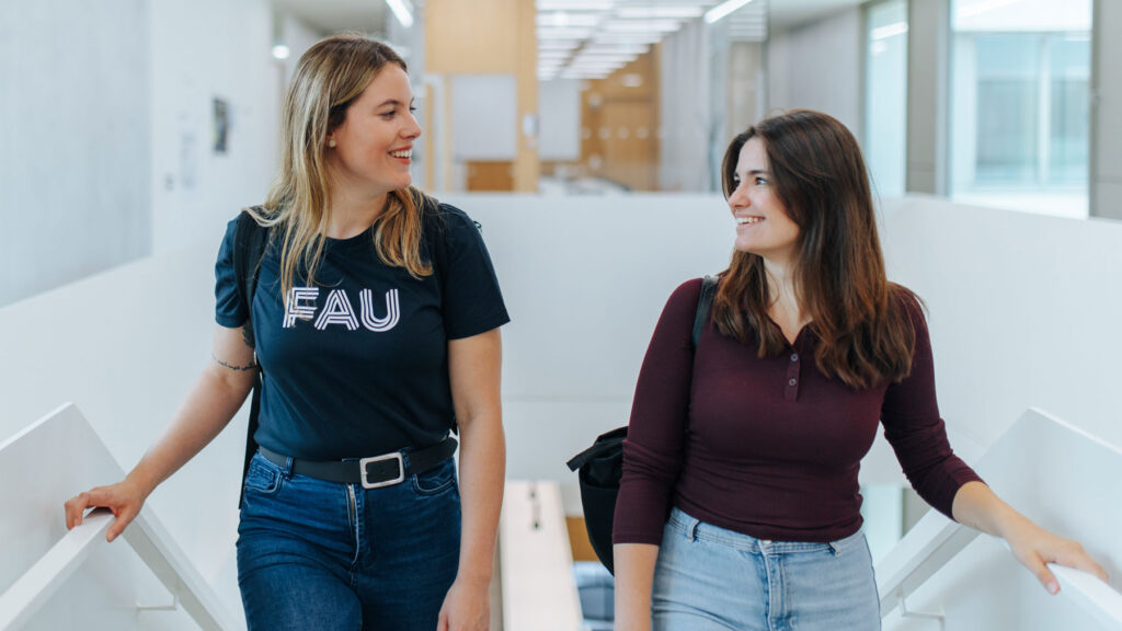 Two student walking on stairs.