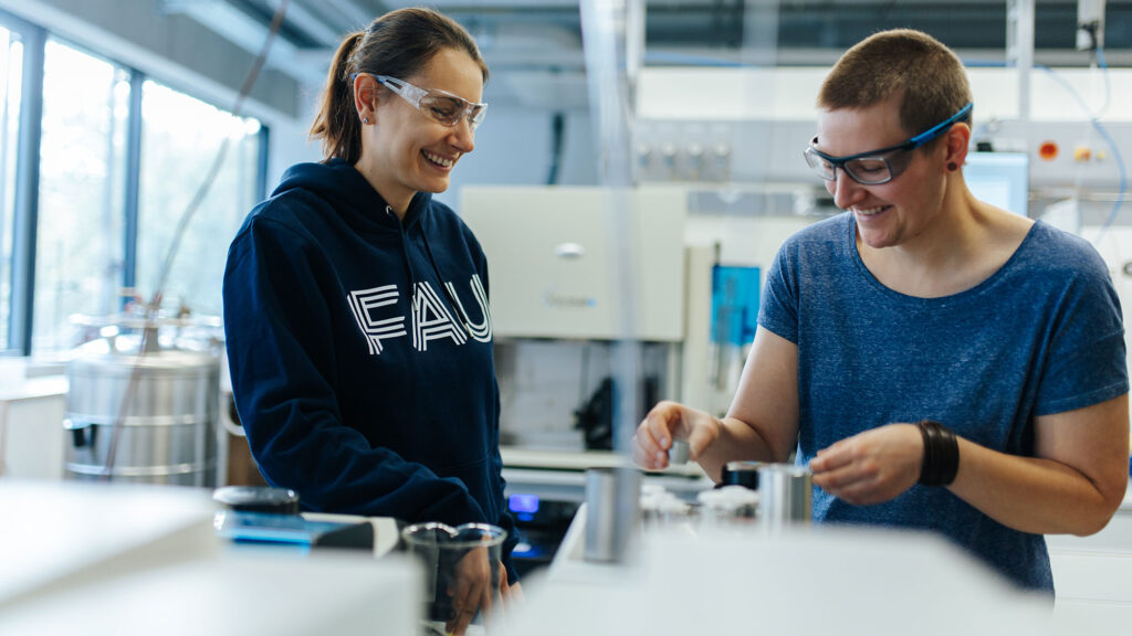 Two poeple in a laboratory.