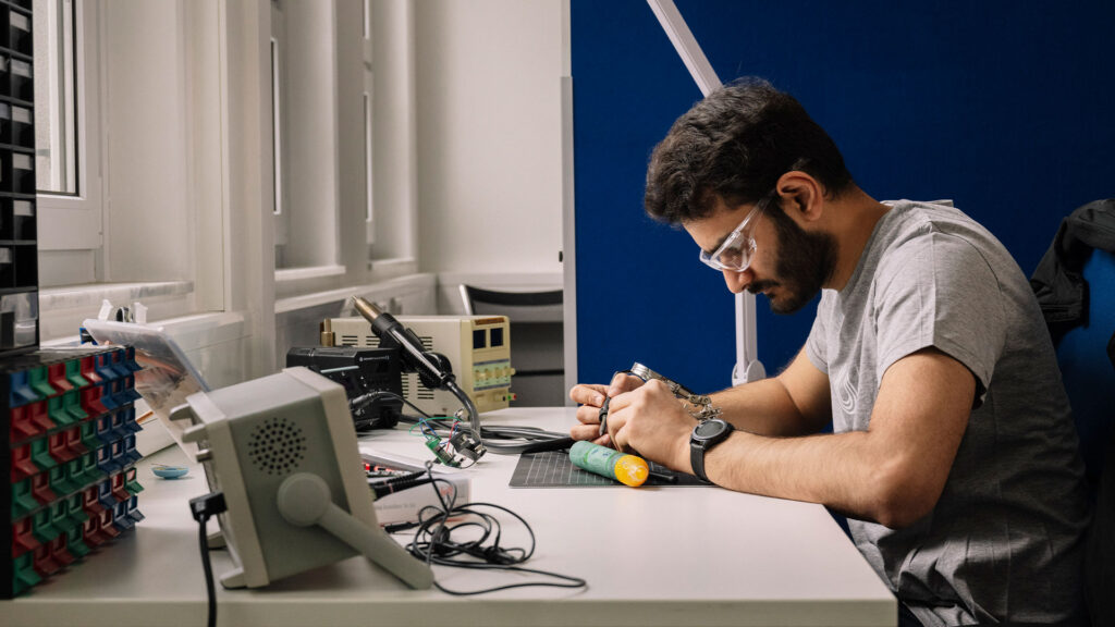 Scientist operating a machine in a laboratory.