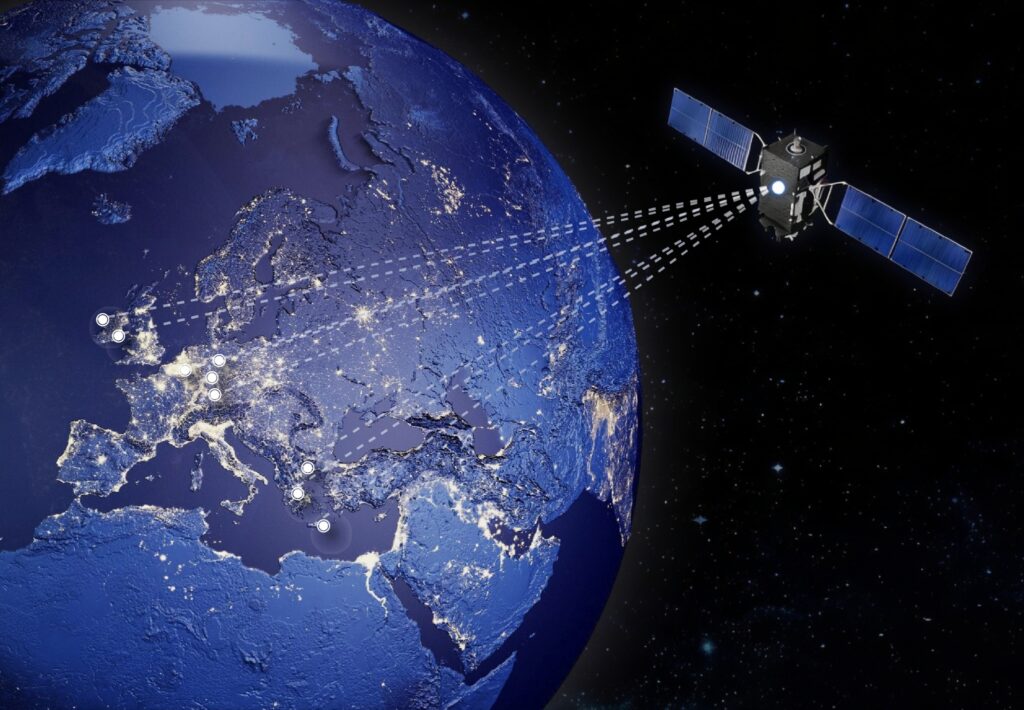 An illustration showing a satellite transmitting signals to ground stations. 