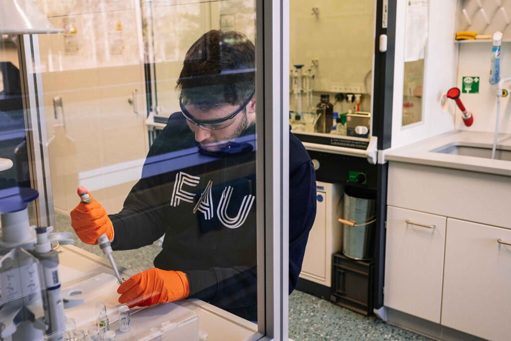 A scientists with security glasses in a laboratory.