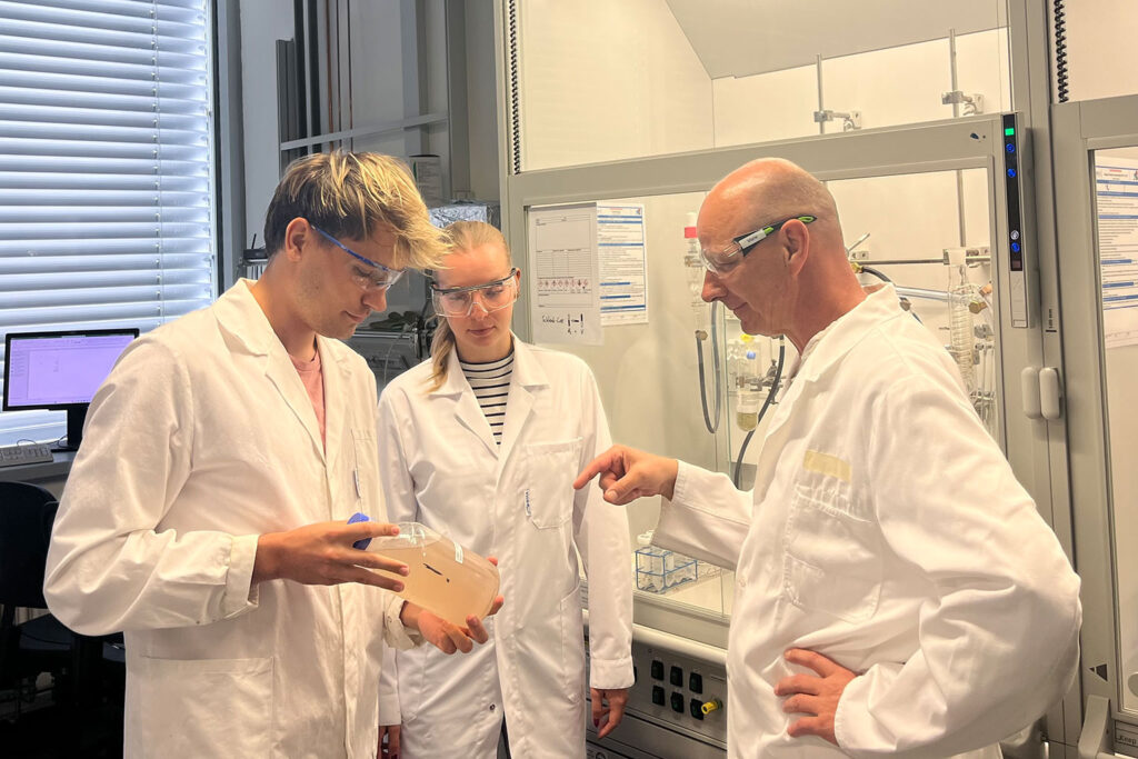 Three scientists in a lab.